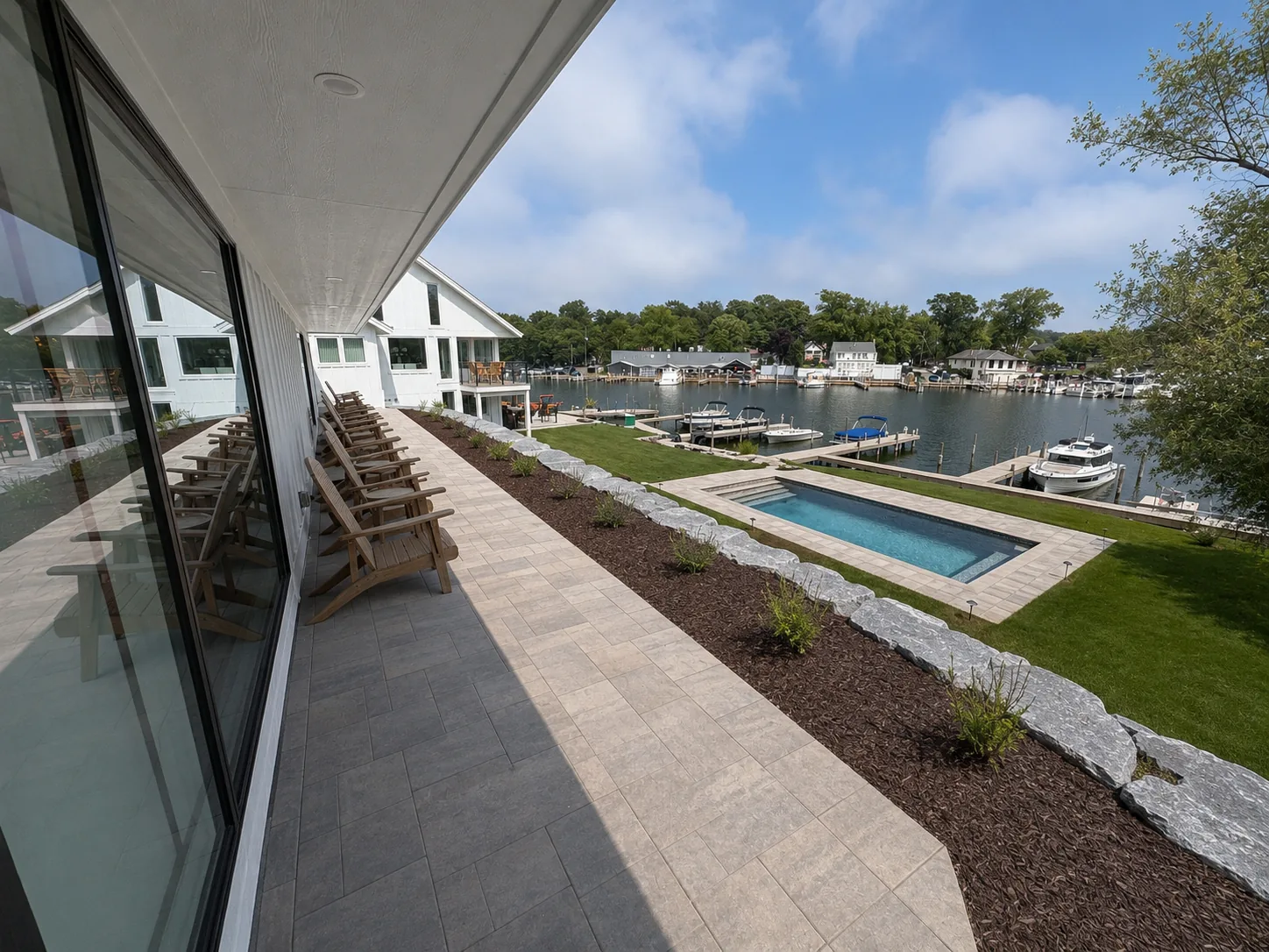 3 Bedroom Lake View — covered balcony overlooking the pool and marina